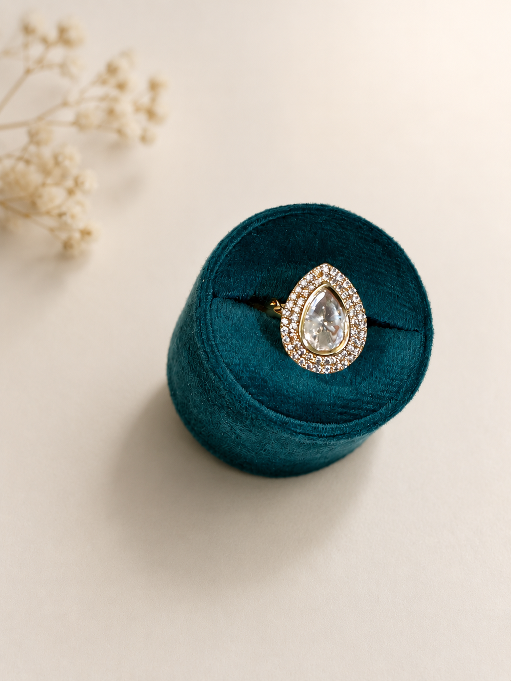 Pear Cut Solitaire Ring with Halo Zircon Detailing