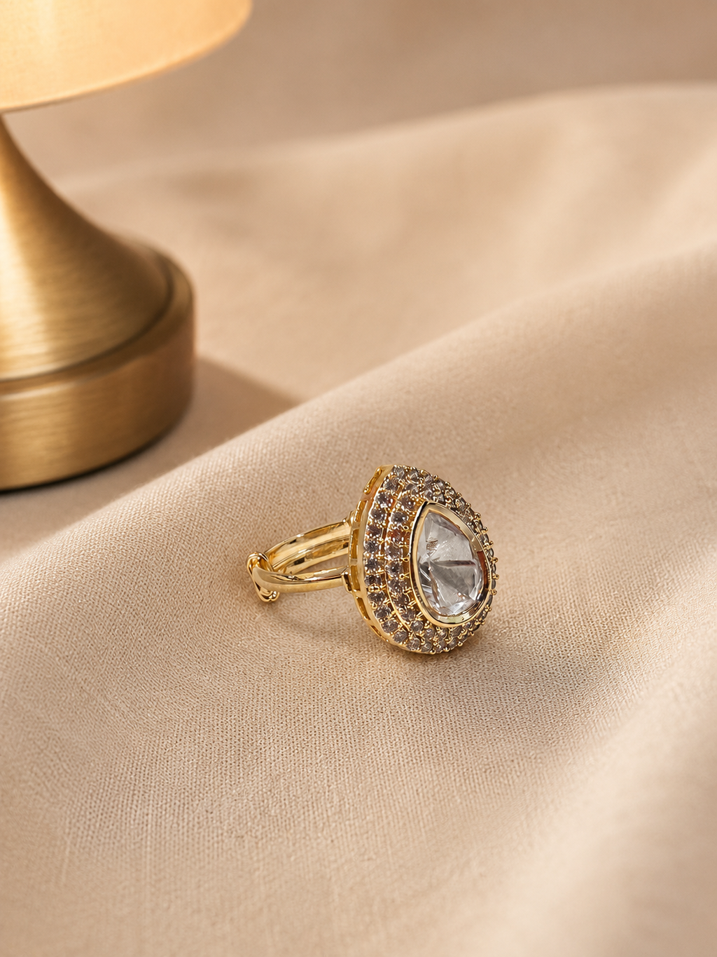 Pear Cut Solitaire Ring with Halo Zircon Detailing