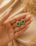 Add timeless elegance to your collection with these Oval Green Stone Stud Earrings, designed with a radiant crystal halo in a gold finish. The rich emerald-toned center stone paired with sparkling crystals creates a refined and luxurious look. Perfect for festive occasions, wedding wear, and elegant everyday styling, these studs offer a graceful blend of tradition and modern charm.