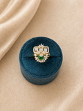 Adjustable green stone statement ring with geometric diamond design and floral halo detailing