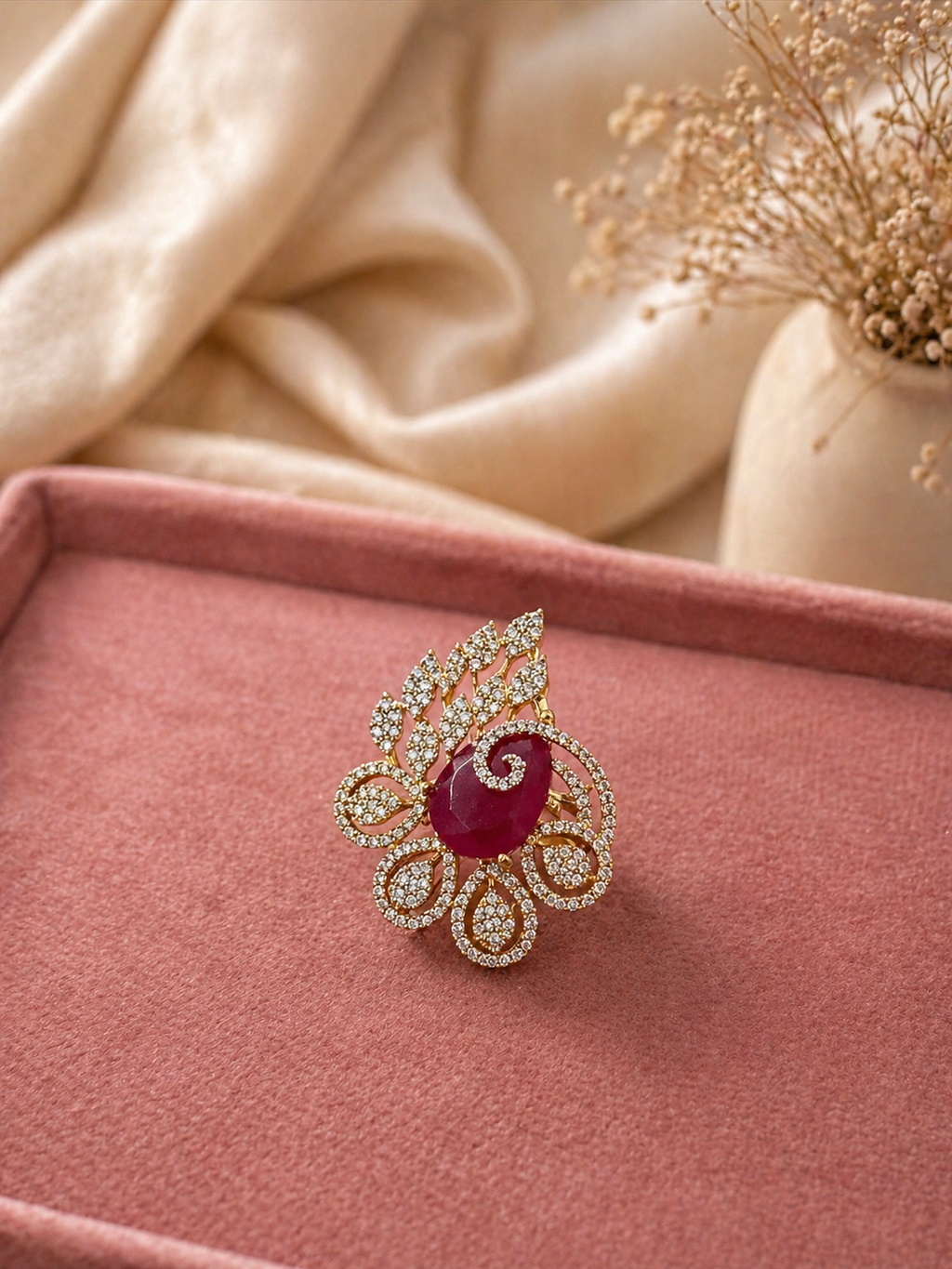 Adjustable ruby red floral statement ring with leaf motif and diamond look detailing