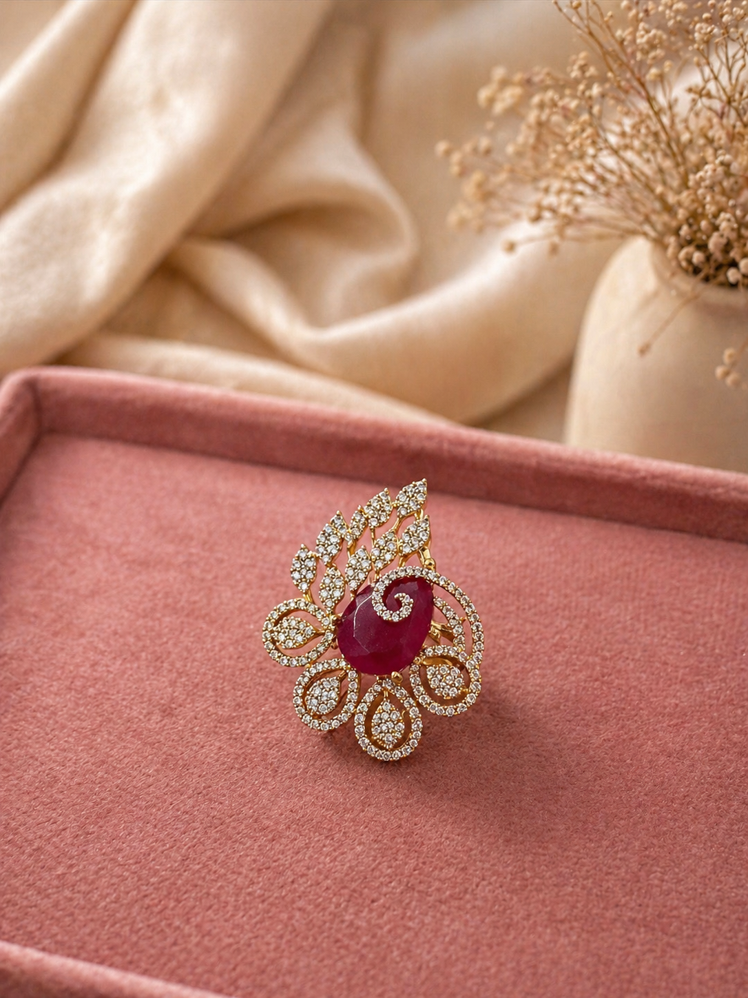 Adjustable ruby red floral statement ring with leaf motif and diamond look detailing