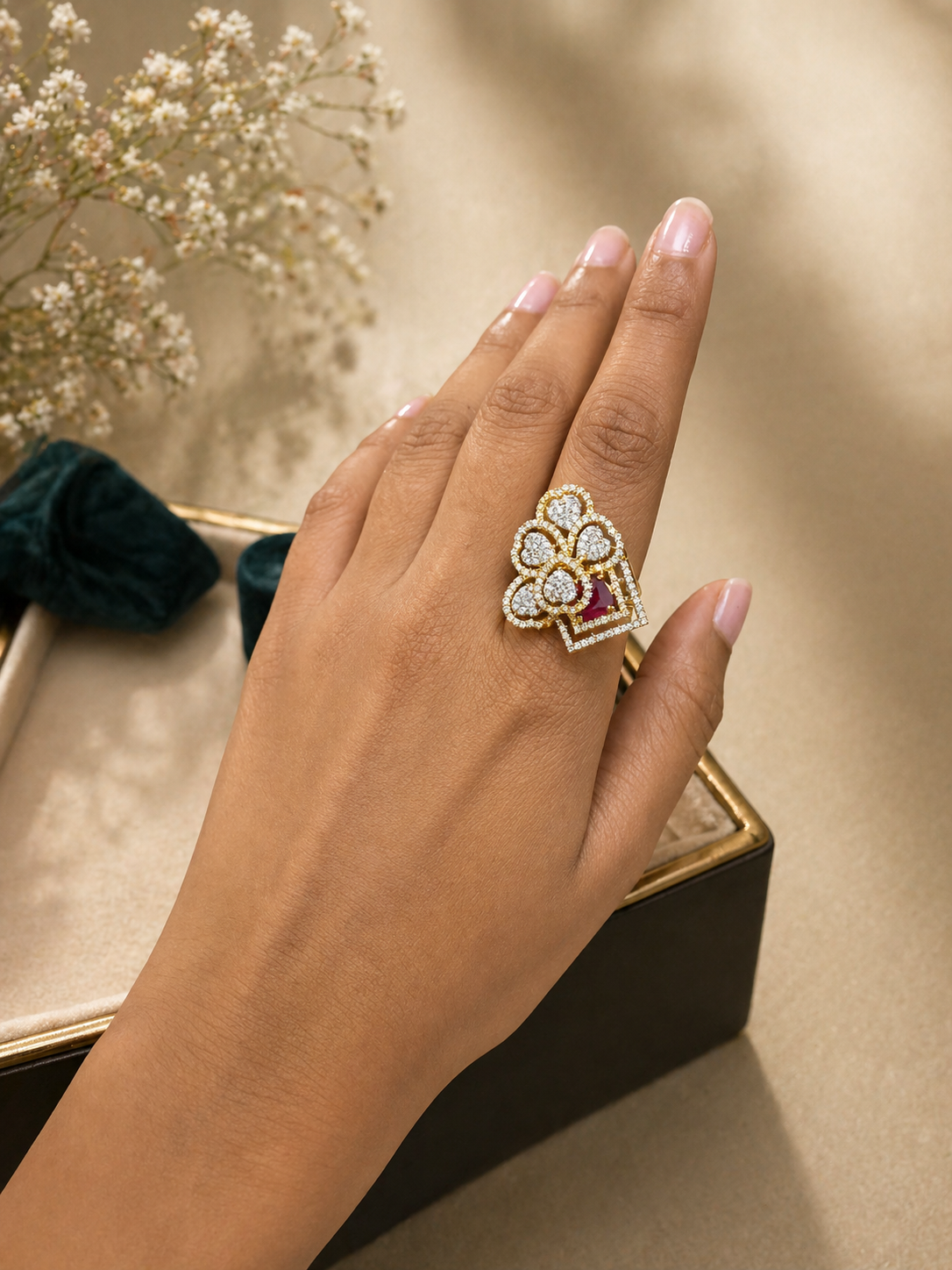 Adjustable statement ring with ruby accent and geometric floral diamond look design worn on hand