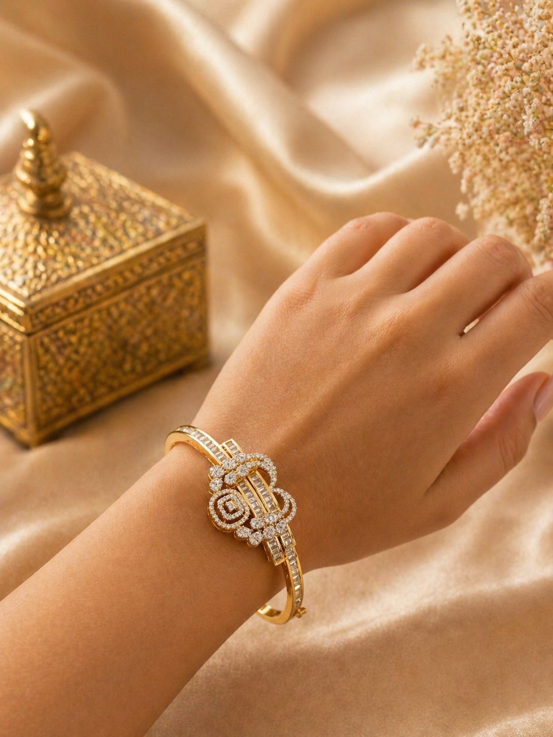 gold plated kada bracelet with diamond design motif and baguette zircon detailing