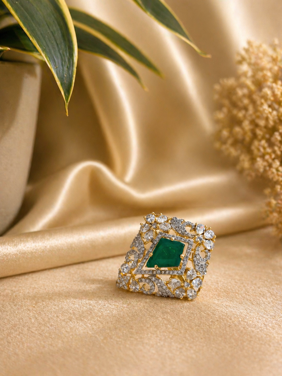 emerald cut green stone statement ring with zircon detailing gold finish adjustable design