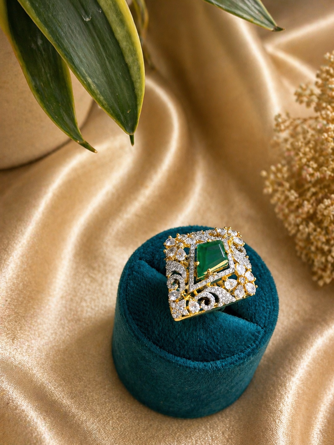 emerald cut green stone statement ring with zircon detailing gold finish adjustable design