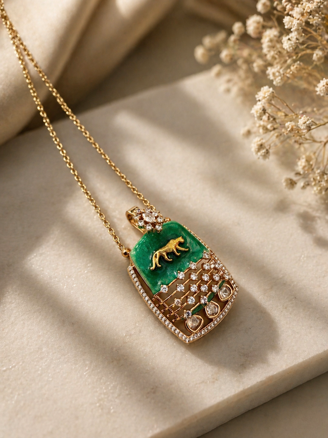 Emerald green enamel statement pendant set with crystal detailing for festive and modern wear
