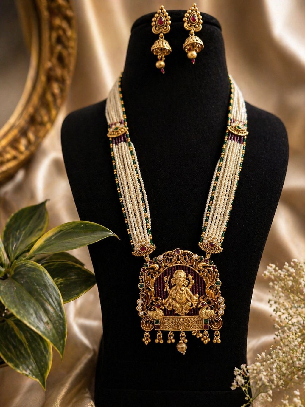 ganesha temple jewellery long necklace with pearl strands and matching jhumka earrings