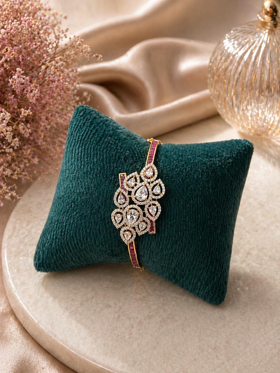 Gold floral bracelet with polki stones and ruby accents in a statement design