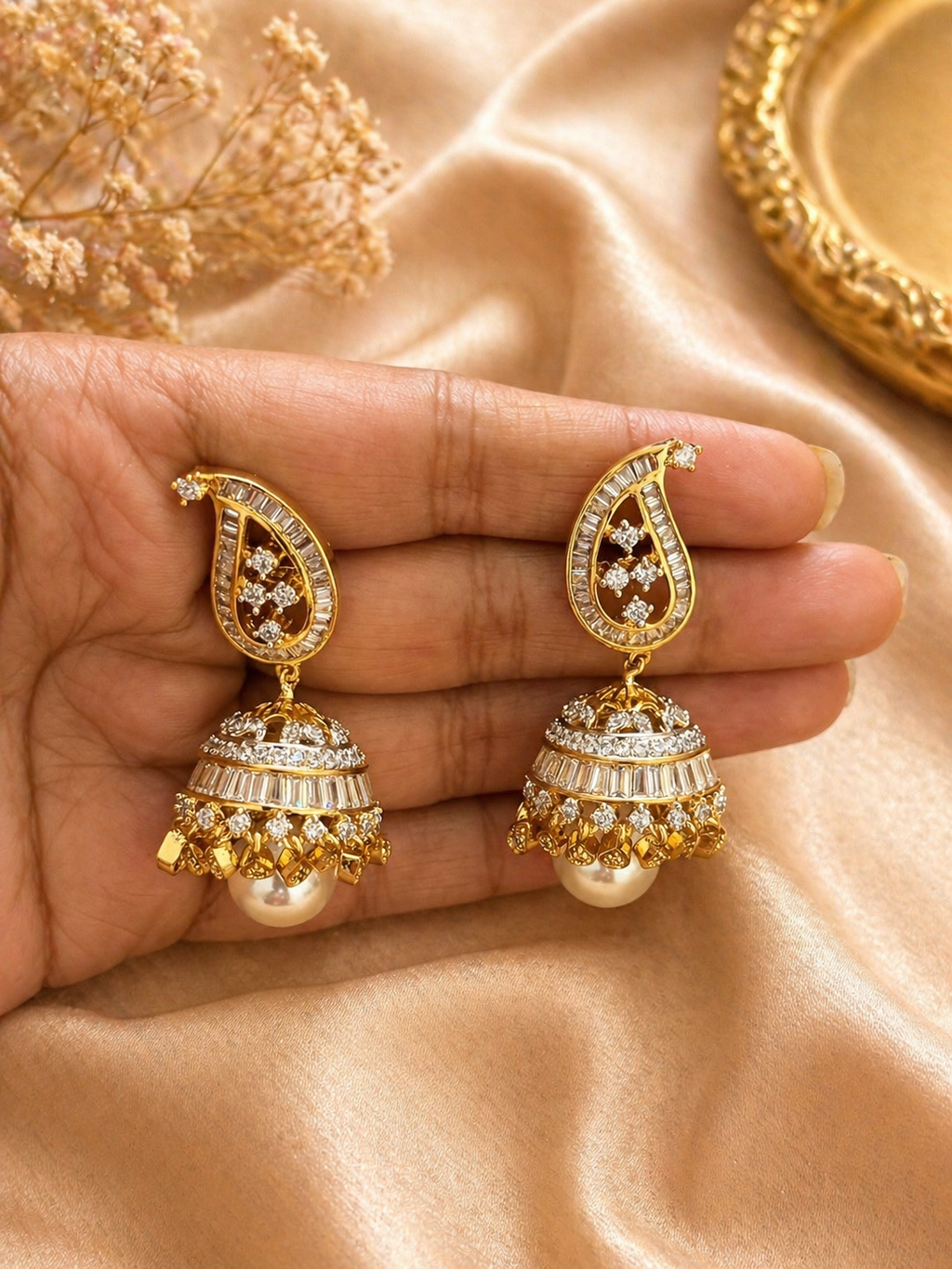 Gold plated kundan jhumka earrings with pearl drop design