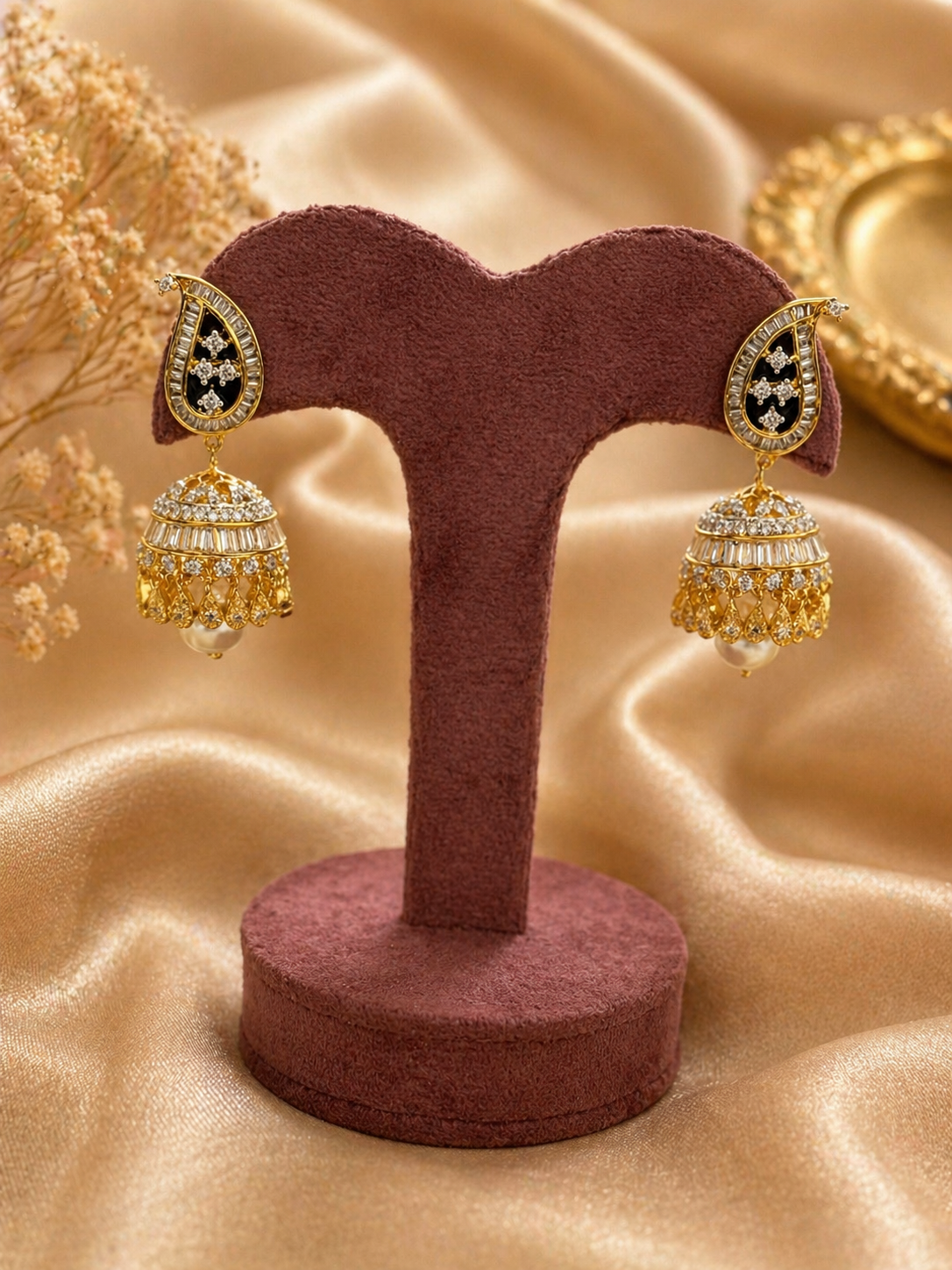 Gold plated kundan jhumka earrings with pearl drop design