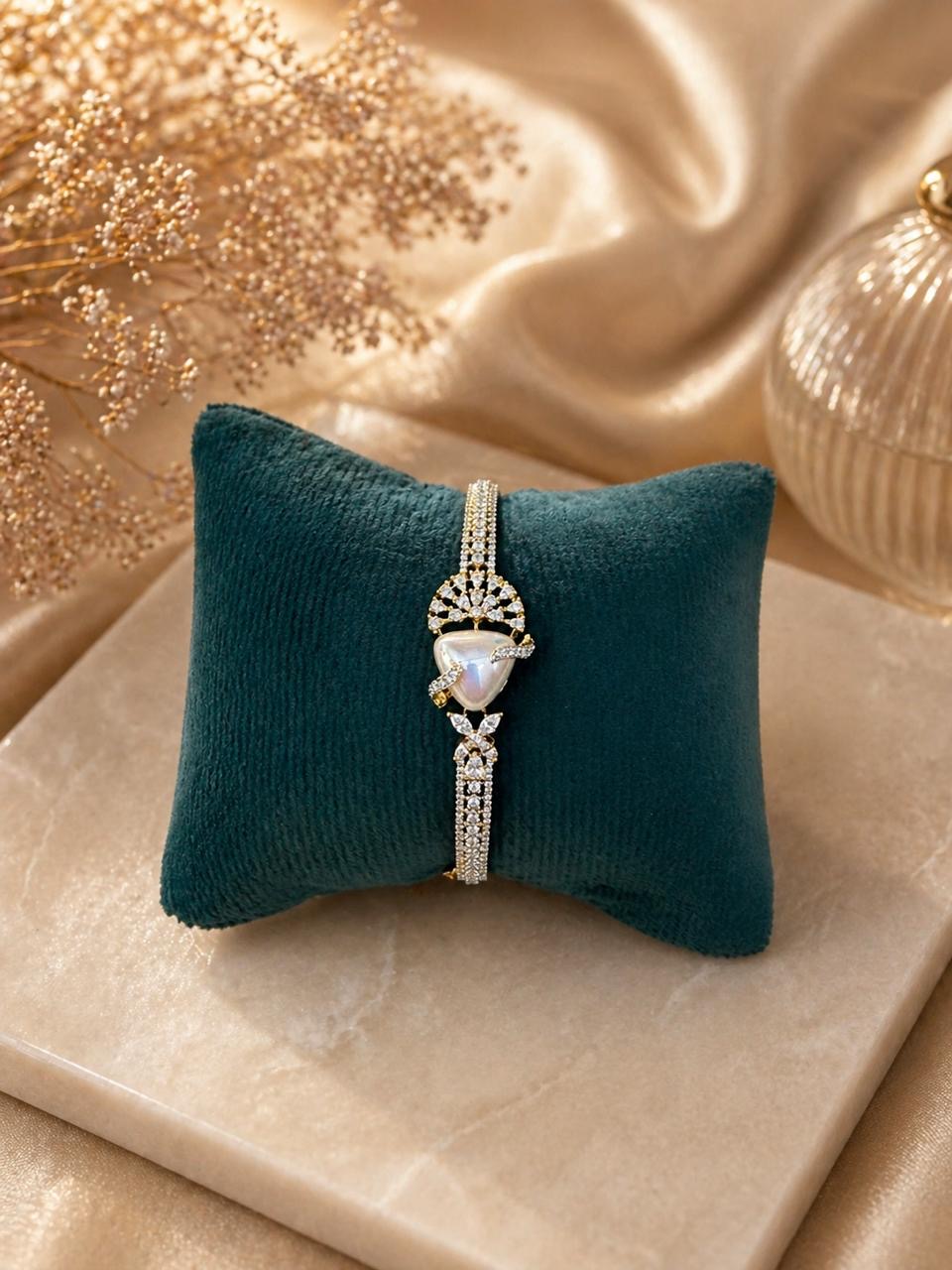 Gold swan bracelet with pearl center and crystal detailing in elegant design