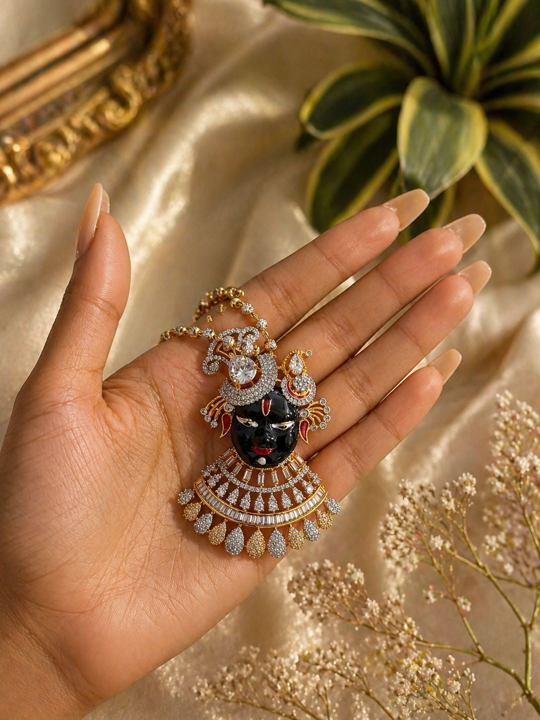 gold plated krishna motif pendant necklace set with cz stones and matching earrings