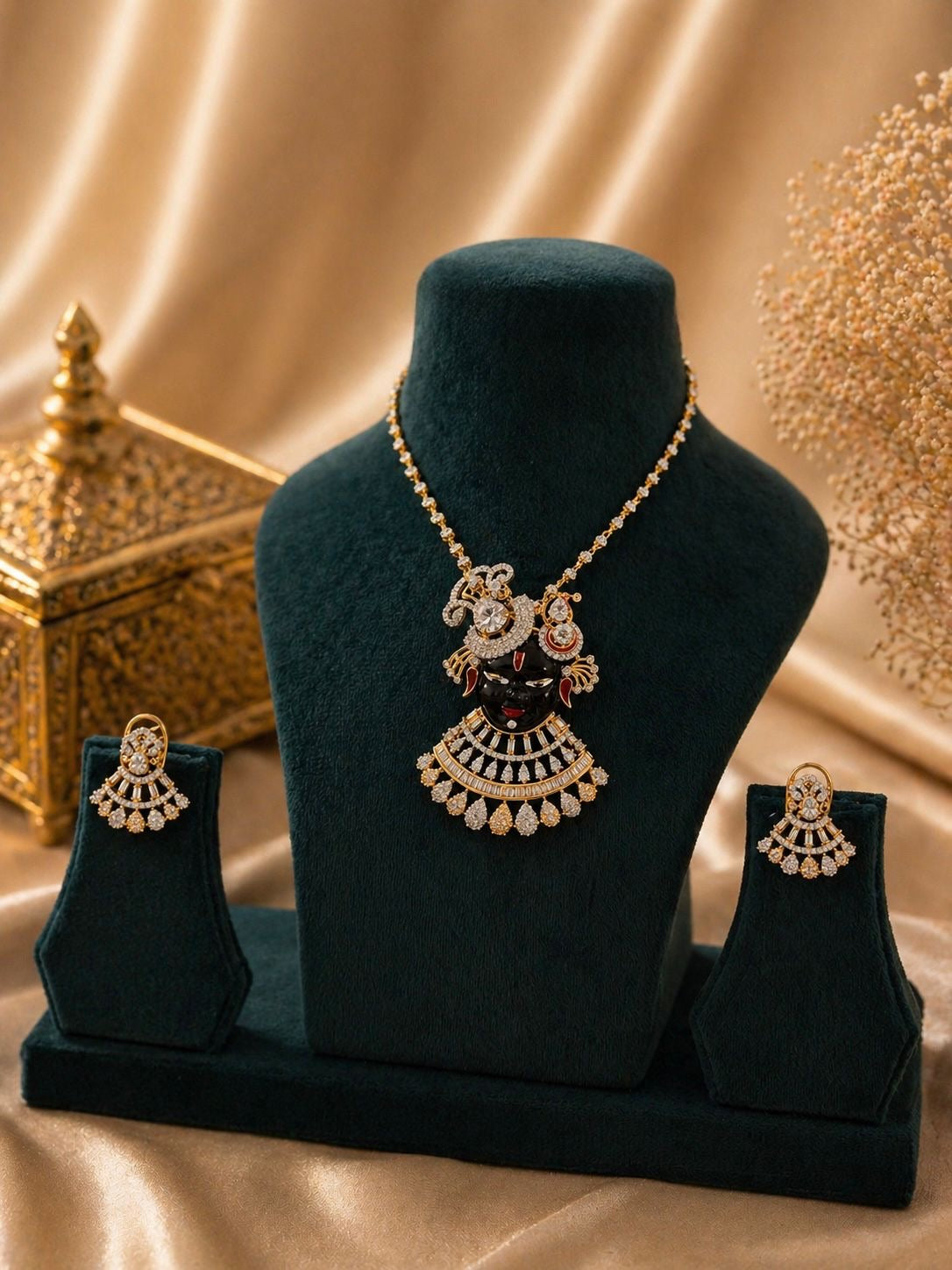 gold plated krishna motif pendant necklace set with cz stones and matching earrings