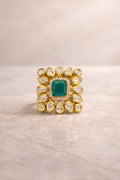 Emerald green statement ring with halo design for festive and wedding wear
