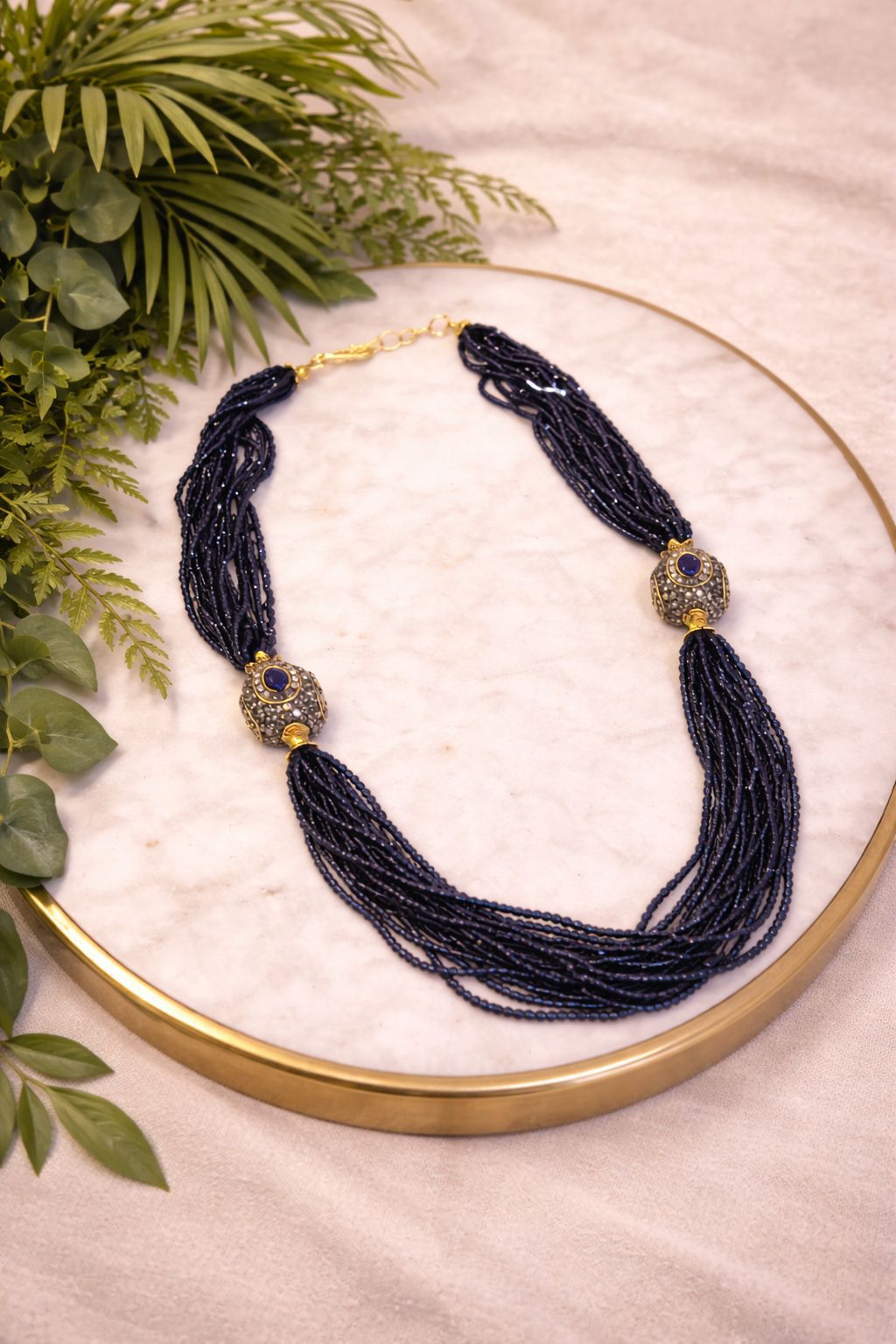 Multi layer necklace with deep blue sapphire beads for evening and festive wear
