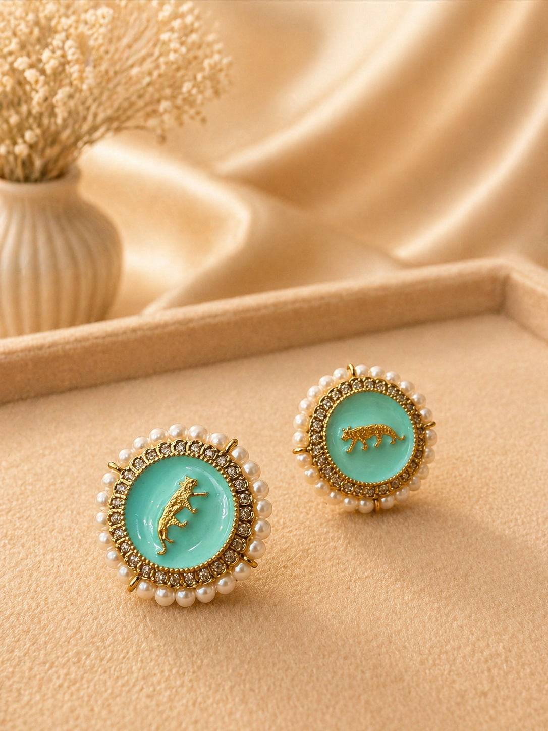 Mint enamel stud earrings with pearl border and tiger motif design for festive and stylish wear