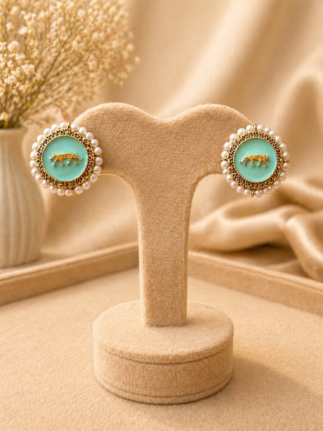 Mint enamel stud earrings with pearl border and tiger motif design for festive and stylish wear