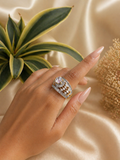 multi layer zircon statement ring with round solitaire accent gold finish worn on hand