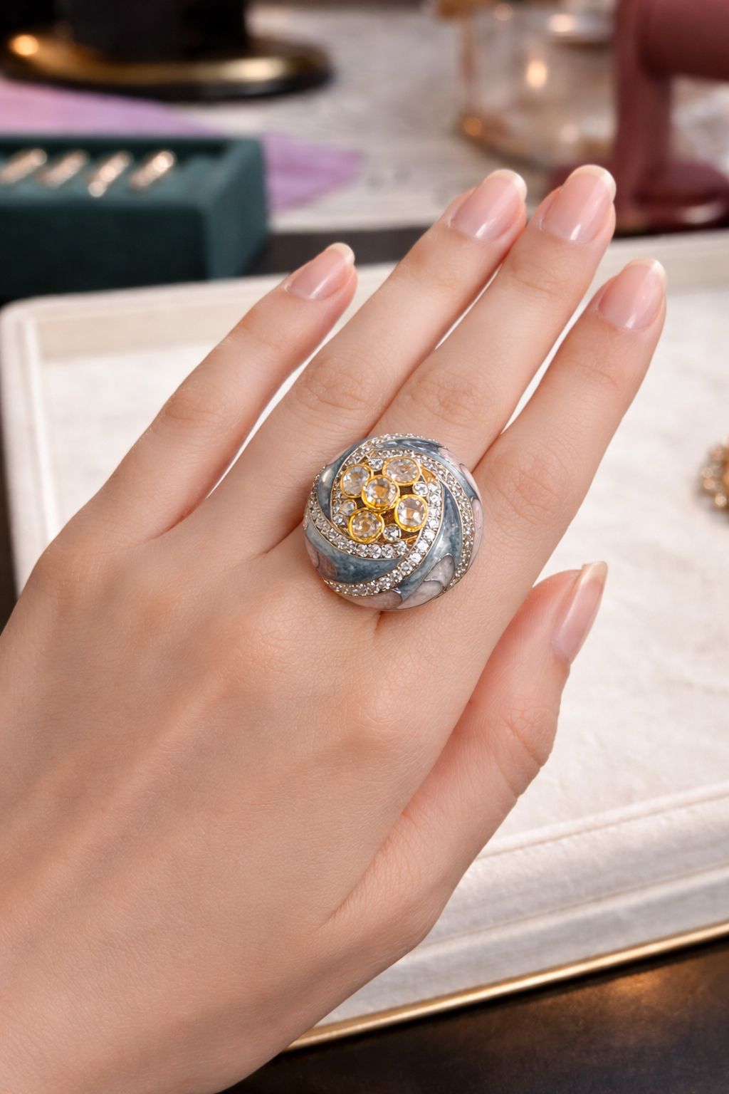 Blue stone statement ring with sculpted design worn on hand for festive and stylish wear