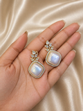 Opal stone statement drop earrings worn on hand with crystal detailing for festive and elegant wear