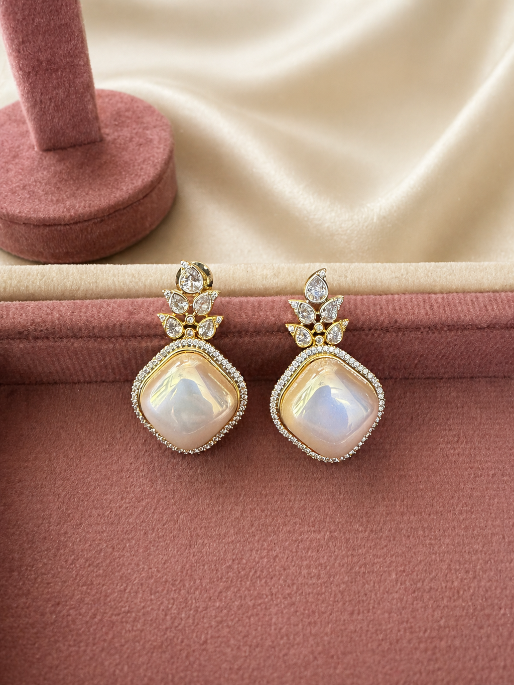 Opal stone statement drop earrings worn on hand with crystal detailing for festive and elegant wear