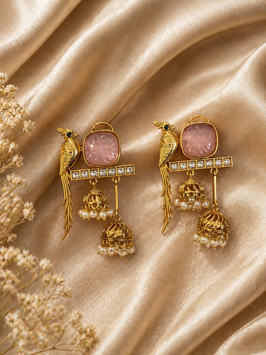 Parrot motif jhumka earrings with pink stone and pearl drops for festive and traditional wear