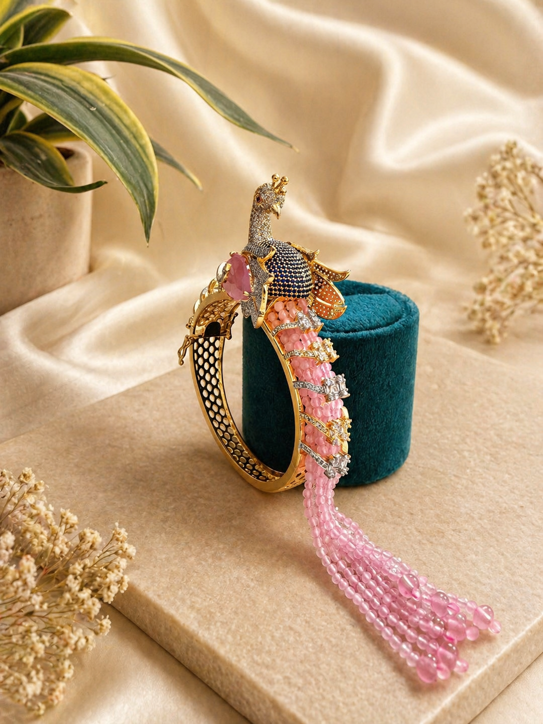 peacock design kada bracelet with pink bead tassels and intricate detailing