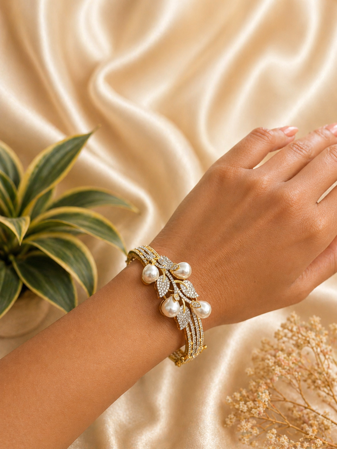 pearl leaf design kada bracelet with zircon stones and elegant gold finish
