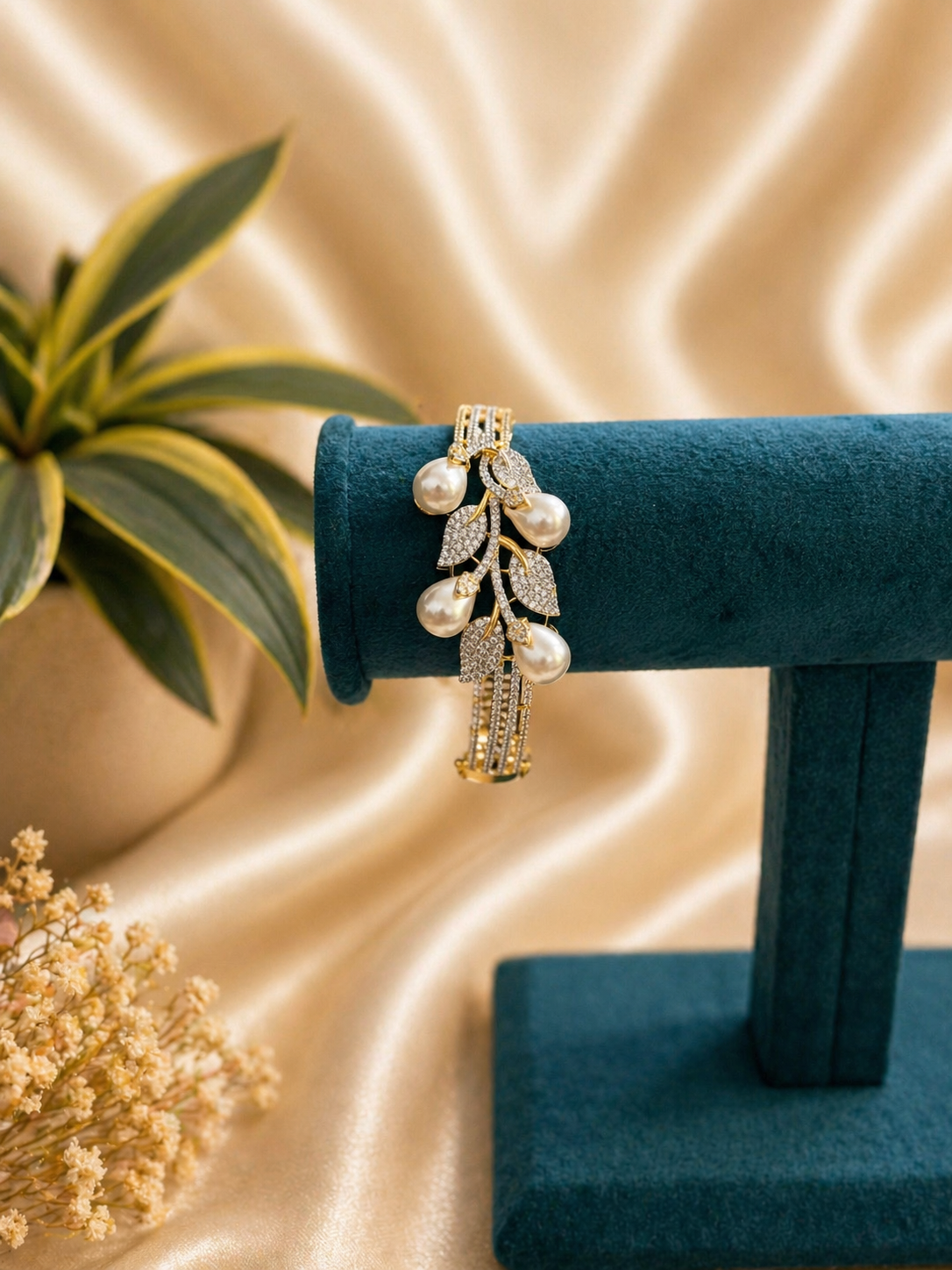 pearl leaf design kada bracelet with zircon stones and elegant gold finish