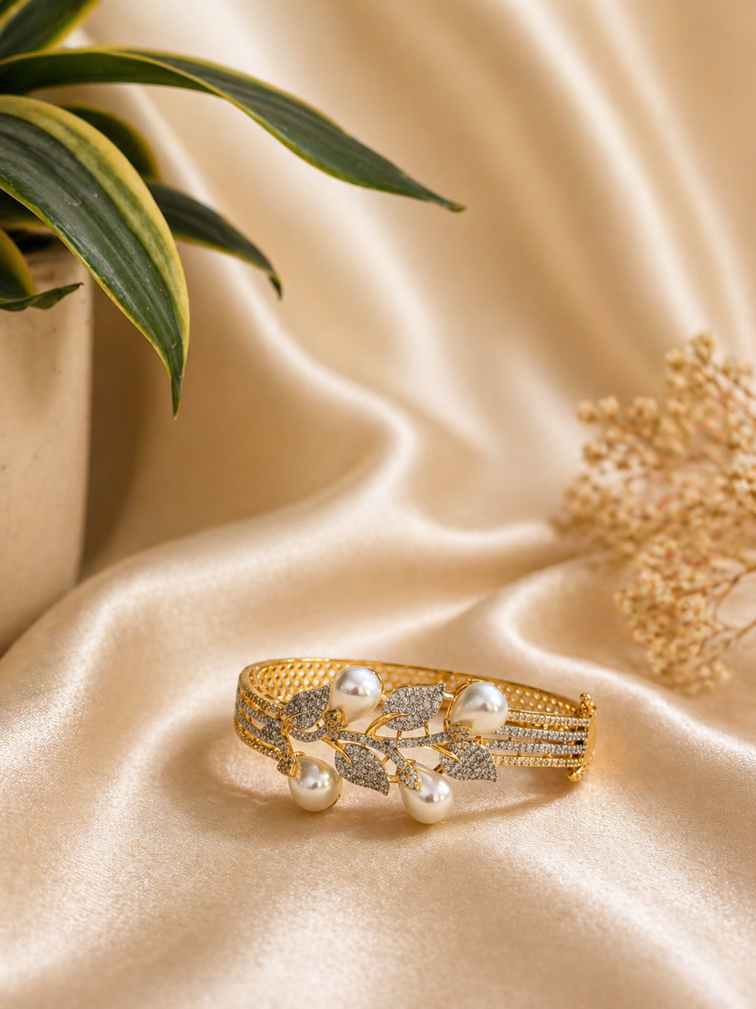 pearl leaf design kada bracelet with zircon stones and elegant gold finish