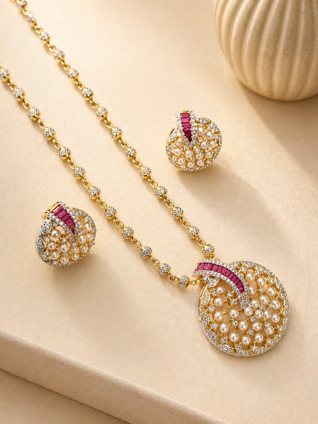 Pearl pendant set with ruby stone accent and crystal detailing for festive and elegant wear