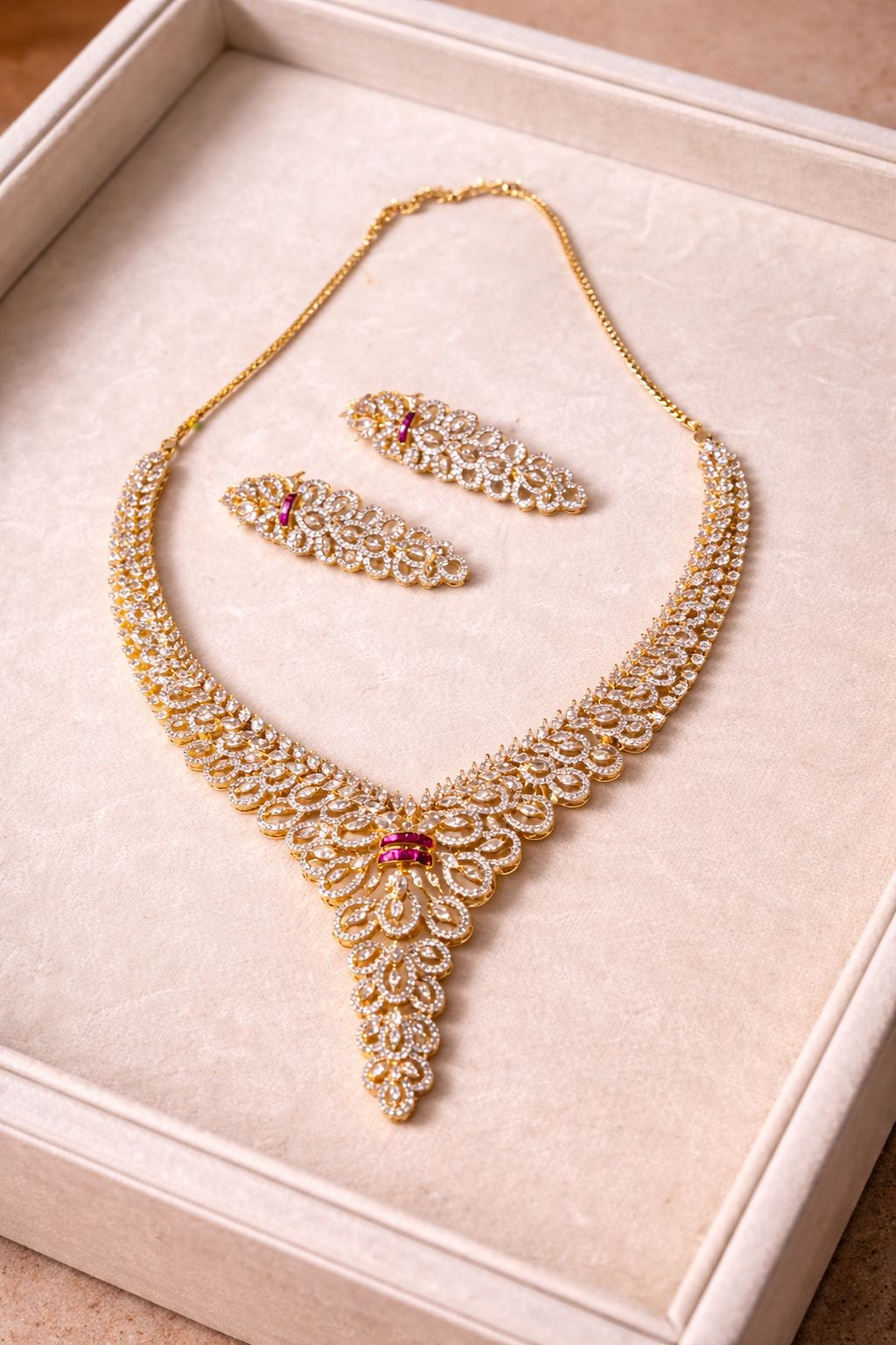 Real diamond look bridal necklace set with cascading design and red stones for wedding wear