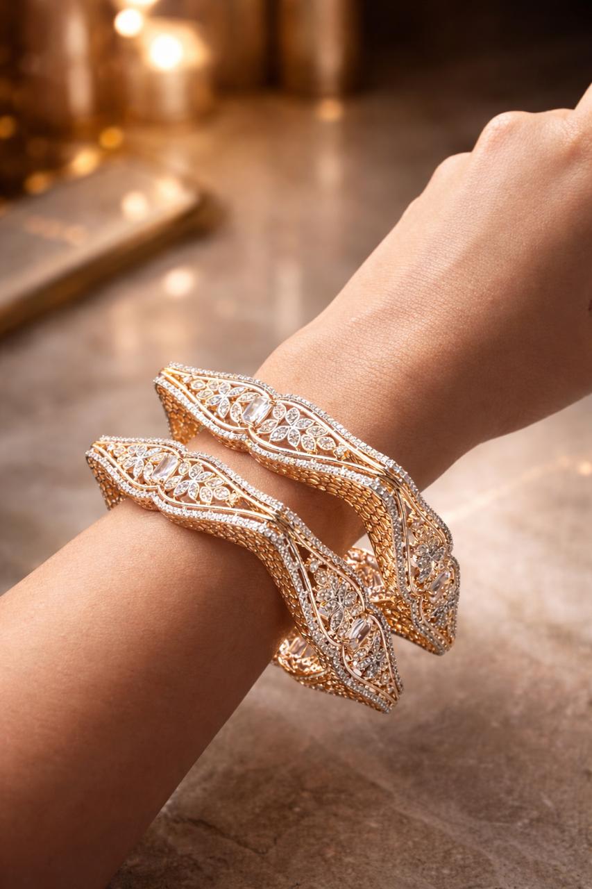 Real gold finish diamond look serpentine design bangles set worn on hand for wedding and festive wear