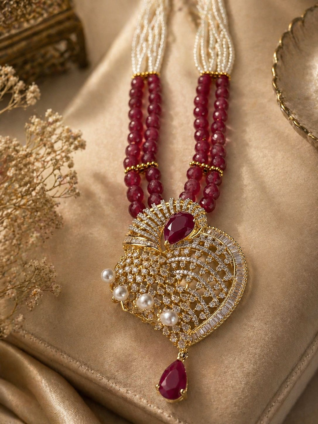 ruby red beaded statement pendant necklace set with matching earrings and pearl detailing