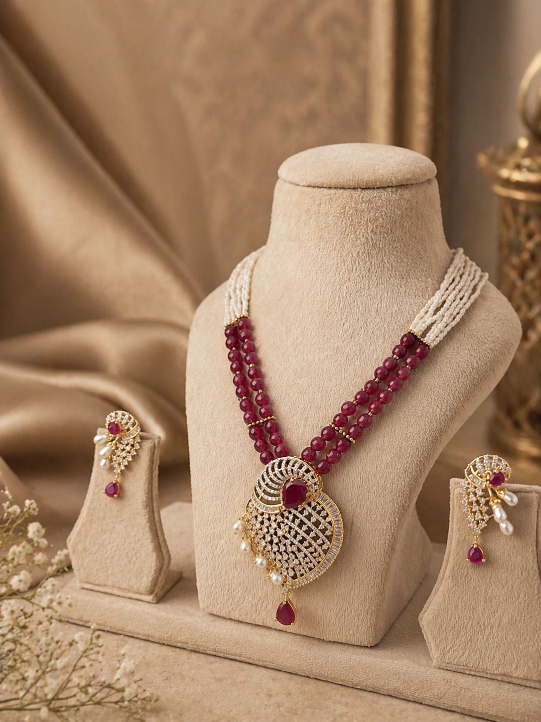 ruby red beaded statement pendant necklace set with matching earrings and pearl detailing