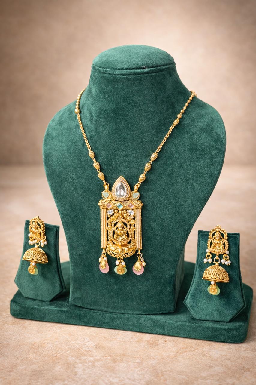 Gold finish temple pendant necklace set with divine motif and multicolor stone drops for festive and traditional wear