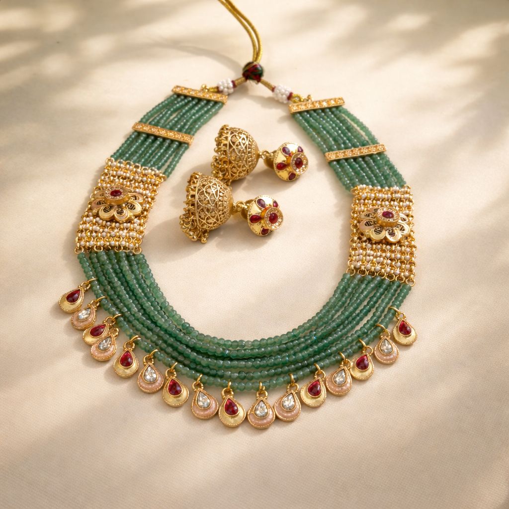 Temple style green beaded necklace set with red stone drops for wedding and festive wear