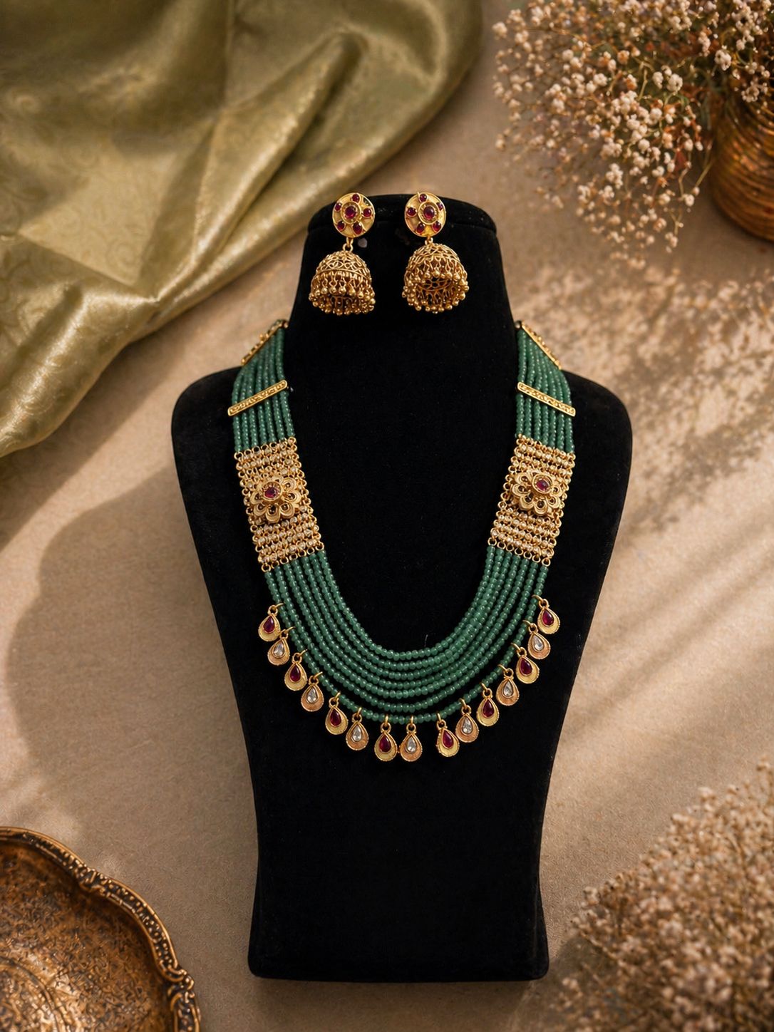 Temple style green beaded necklace set with red stone drops for wedding and festive wear