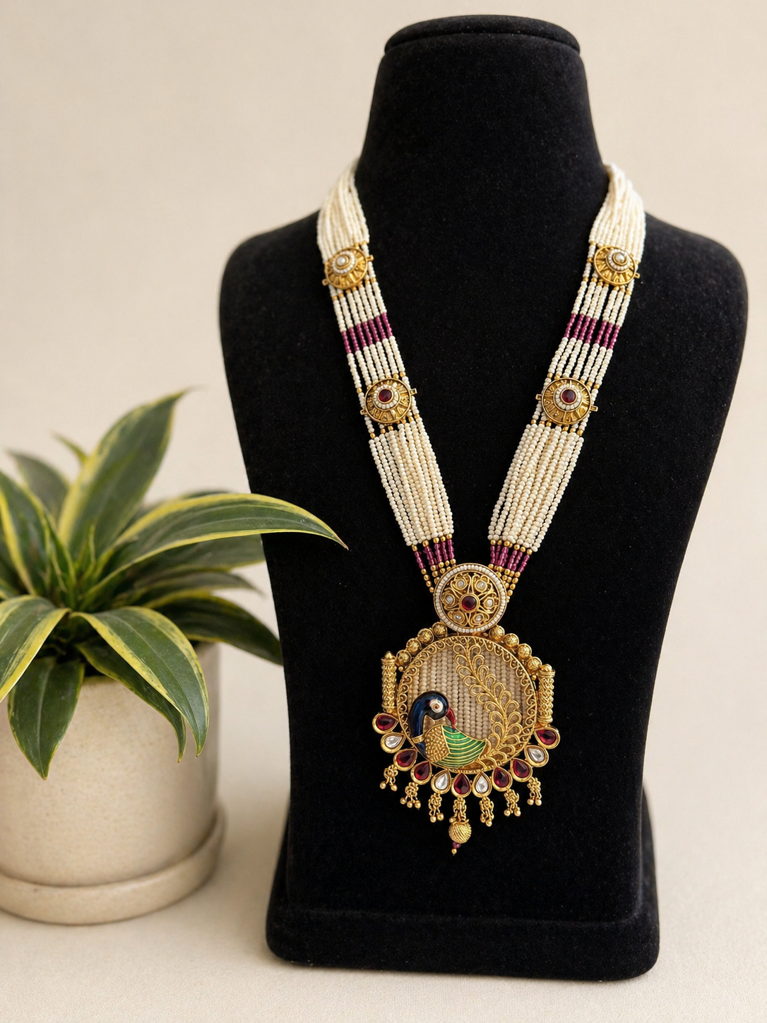 traditional peacock motif kundan necklace set with pearl bead strands and matching earrings