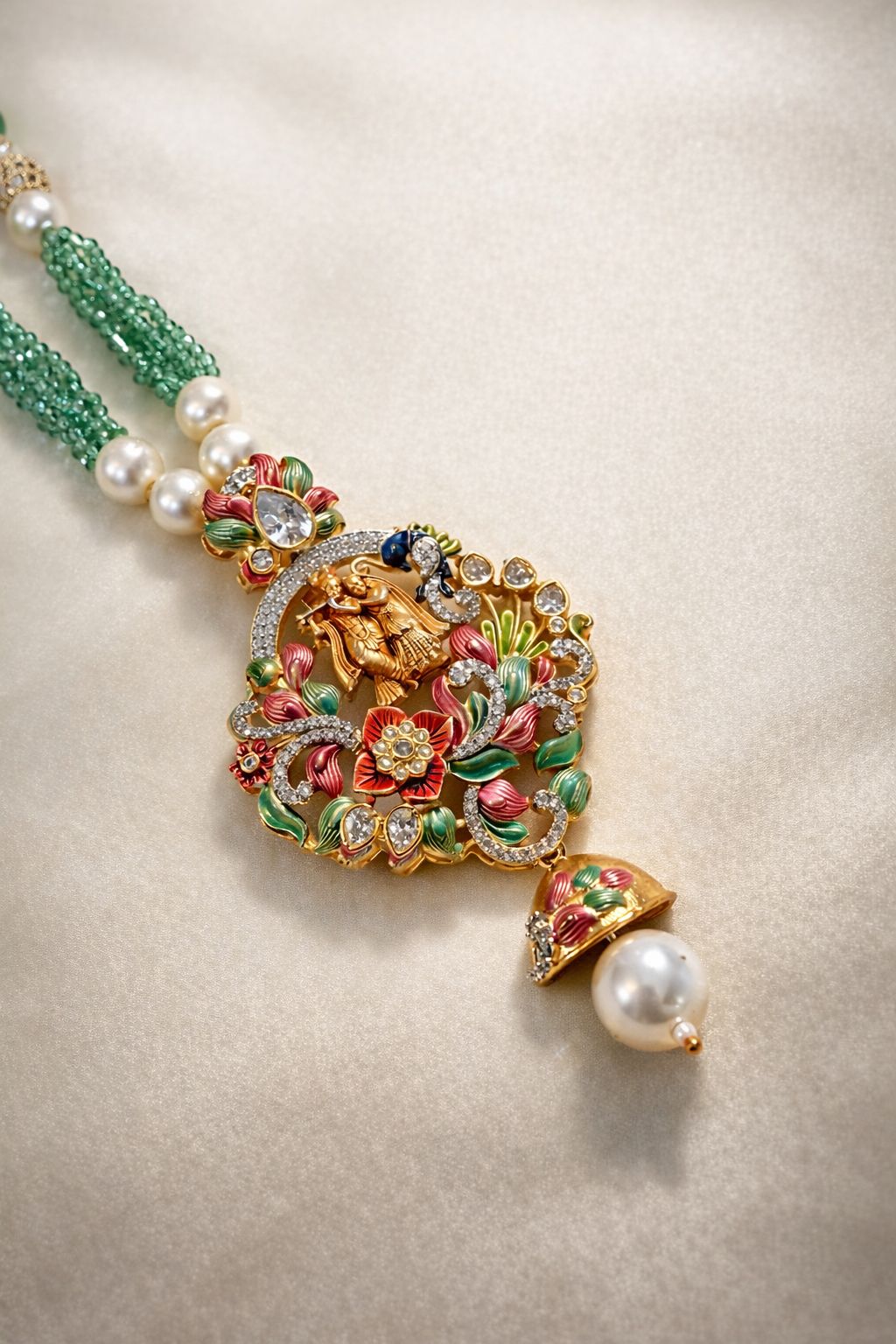 Gold finish temple pendant set with Krishna motif and multicolor detailing for festive and traditional wear